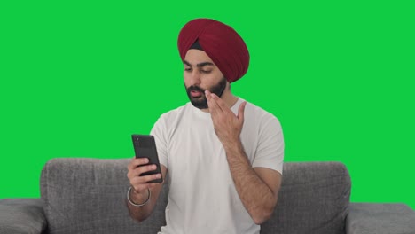 Angry-Sikh-Indian-man-shouting-on-video-call-Green-screen