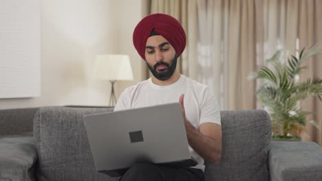 Angry-Sikh-Indian-manager-shouting-on-video-call-on-Laptop