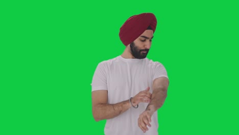 Confident-Sikh-Indian-man-getting-ready-Green-screen