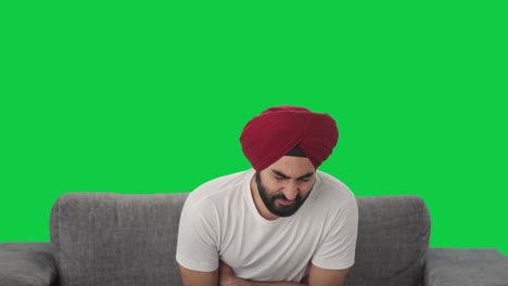 Sick-Sikh-Indian-man-suffering-from-stomach-pain-Green-screen