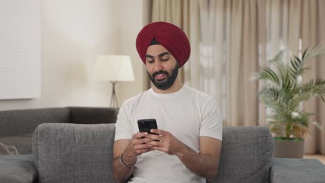 Happy-Sikh-Indian-man-chatting-with-someone
