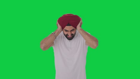 Wütender-Sikh-Indianer-Schreit-Mit-Geschlossenen-Ohren,-Grüner-Bildschirm