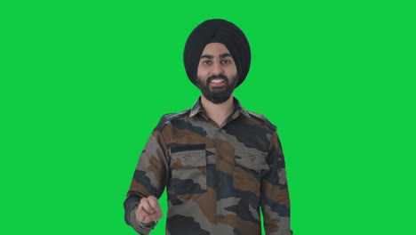 Happy-Sikh-Indian-Army-man-showing-victory-sign-Green-screen