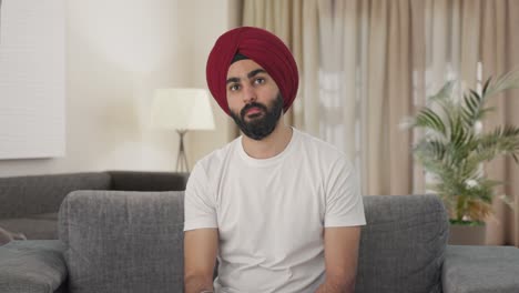 Serious-Indian-Sikh-Indian-man-Indian-watching-TV
