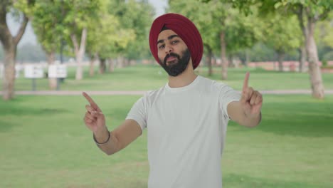 Happy-Sikh-Indian-man-dancing-and-doing-Bhangra-in-park