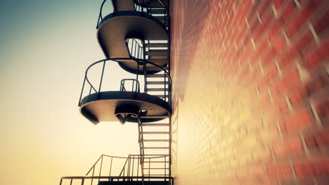 Footage-showing-never-ending-spiral-stairway-near-the-red-bricked-wall.-Amazing-sunrise-lighting.-The-climb-onto-the-top-of-infinite-high-urban--building-by-the-endless-amount-of-stair’s-steps.