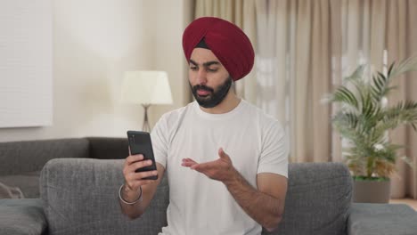 Sikh-Indian-man-talking-on-video-call