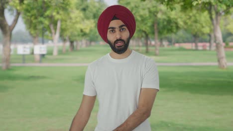 Angry-Sikh-Indian-man-shouting-on-someone-in-park