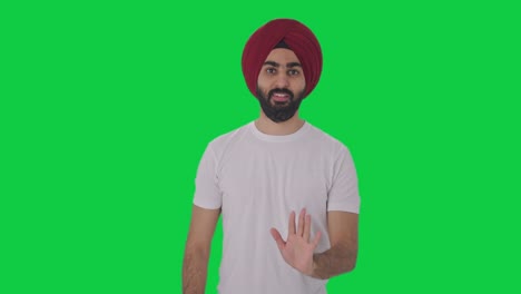 Guilty-Sikh-Indian-man-saying-sorry-and-apologizing-Green-screen