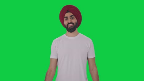 Fröhlicher-Sikh-Indianer,-Der-Schwere-Hanteln-Hebt,-Grüner-Bildschirm