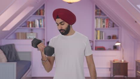 Sikh-Indian-man-lifting-heavy-dumbbells