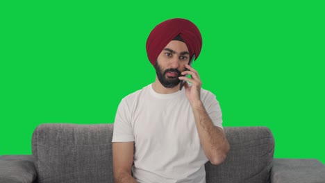 Angry-Sikh-Indian-man-shouting-on-phone-Green-screen