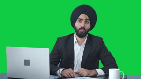 Angry-Sikh-Indian-businessman-shouting-on-someone-Green-screen