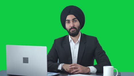 Happy-Sikh-Indian-businessman-showing-victory-sign-Green-screen