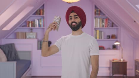 Hombre-Indio-Sikh-Usando-Dinero-Como-Ventilador-En-Actitud