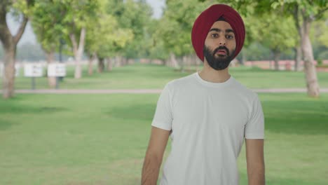 Sikh-Indian-man-looking-and-searching-someone-in-park