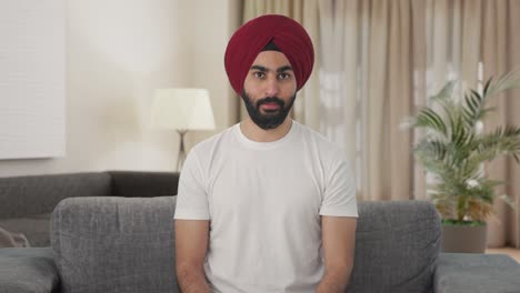 Serious-Sikh-Indian-man-talking-to-someone