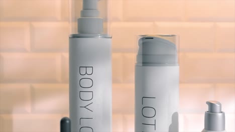 Close-up-of-skincare-bottles-in-3D-animation,-showcasing-modern-design-with-clean-lines-and-transparent-materials-on-a-reflective-surface.