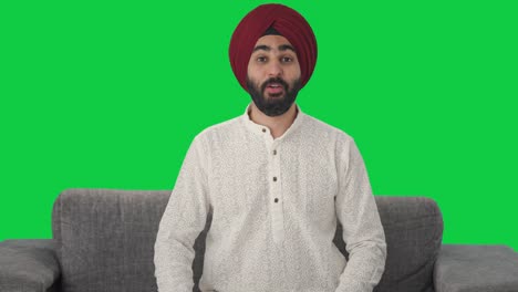 Fröhlicher-Sikh-Indianer,-Der-Auf-Grünem-Bildschirm-Spricht