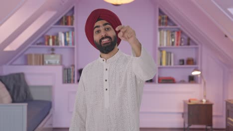 Happy-Sikh-Indian-man-pointing-and-calling-someone