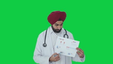 Sikh-Indian-doctor-explaining-medical-reports-to-patient-Green-screen