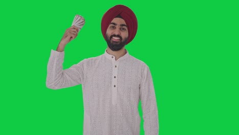 Glücklicher-Sikh-Indianer,-Der-Geld-Als-Fan-Greenscreen-Verwendet