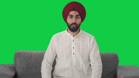 Sikh-Indian-man-talking-to-someone-Green-screen