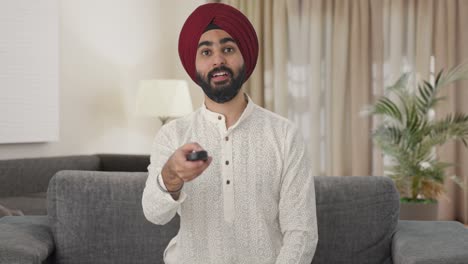 Sikh-Indian-man-watching-TV