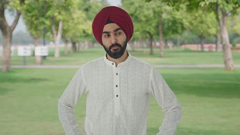 Angry-Sikh-Indian-man-looking-to-the-camera-in-park
