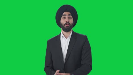 Glücklicher-Indischer-Sikh-Geschäftsmann,-Der-Auf-Grünem-Bildschirm-Spricht