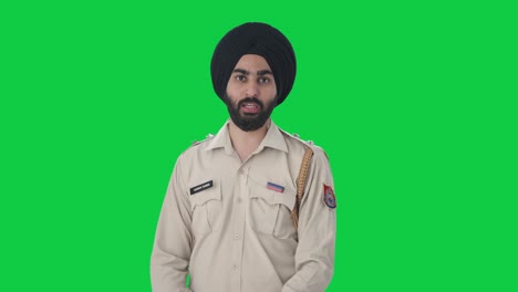 Angry-Sikh-Indian-police-man-talking-Green-screen