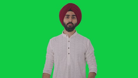 Un-Hombre-Indio-Sikh-Enojado-Desafiando-A-Alguien-A-Luchar-Contra-La-Pantalla-Verde