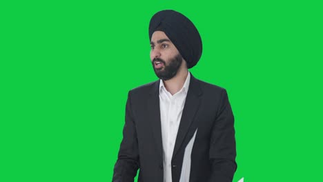 Sikh-Indian-businessman-shouting-on-employees-Green-screen