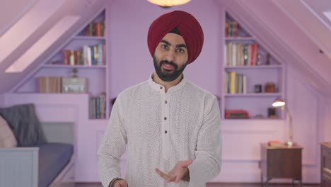 Happy-Sikh-Indian-man-talking-to-the-camera