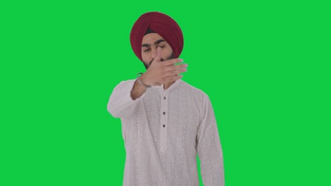Angry-Sikh-Indian-man-stopping-someone-Green-screen