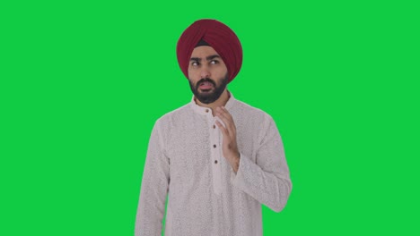 Sick-Sikh-Indian-man-suffering-from-tooth-pain-Green-screen
