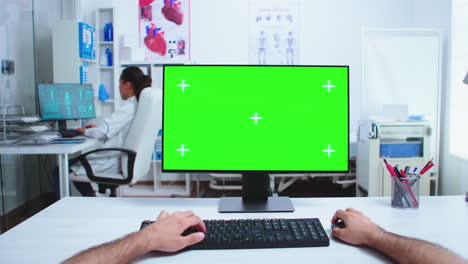 Woman-using-touchpad-with-green-screen