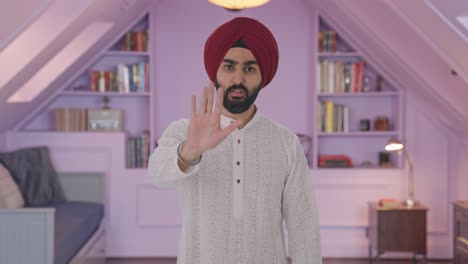 Sikh-Indian-man-stopping-someone