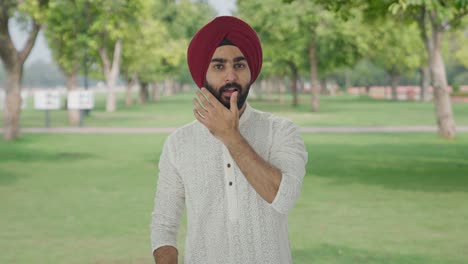 Happy-Sikh-Indian-man-getting-ready-to-go-out-in-park