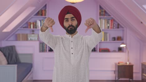 Disappointed-Sikh-Indian-man-showing-thumbs-down