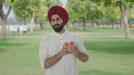 Sick-Sikh-Indian-man-having-an-heart-attack-in-park