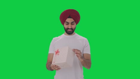 Happy-Sikh-Indian-man-receives-a-gift-Green-screen