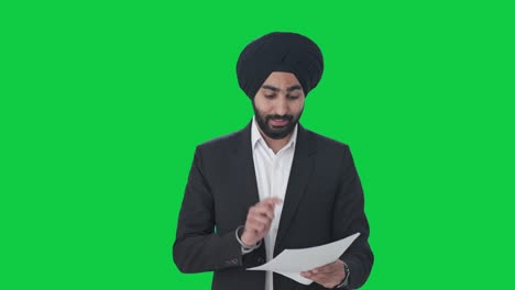 Happy-Sikh-Indian-businessman-congratulating-employees-Green-screen