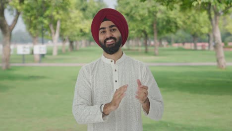 Sikh-Indian-man-clapping-and-appreciating-in-park