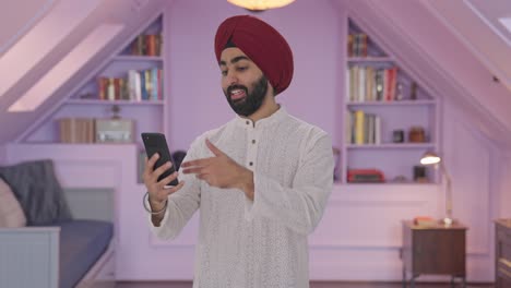 Happy-Sikh-Indian-man-talking-on-video-call