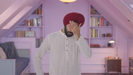 Sick-Sikh-Indian-man-suffering-from-headache