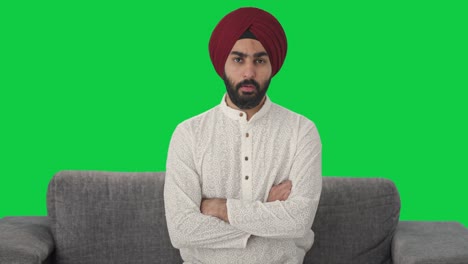 Serious-Sikh-Indian-man-looking-Green-screen