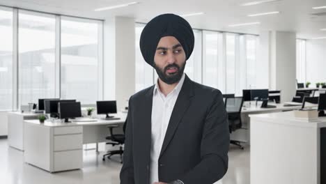 Angry-Sikh-Indian-businessman-shouting-on-employees