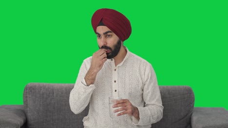 Sikh-Indianer,-Der-Medikamente-Einnimmt,-Grüner-Bildschirm