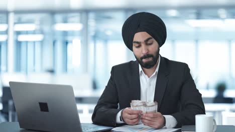 Egoistic-Sikh-Indian-businessman-counting-money